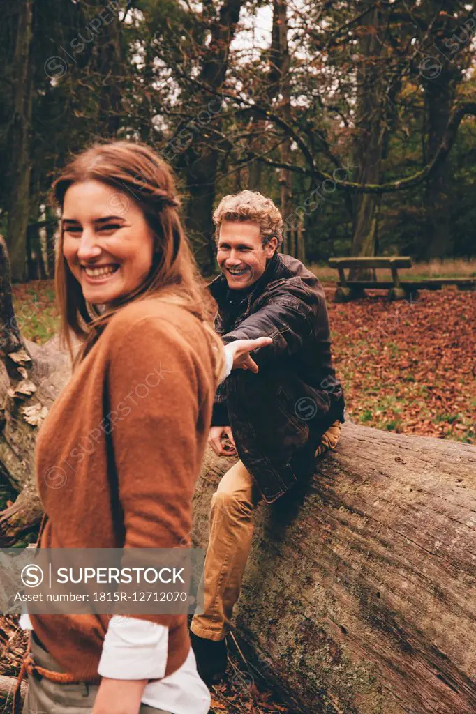 Happy young couple in an autumnal park