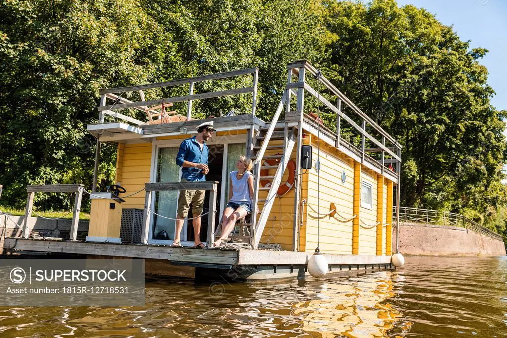 Couple having a trip on a house boat