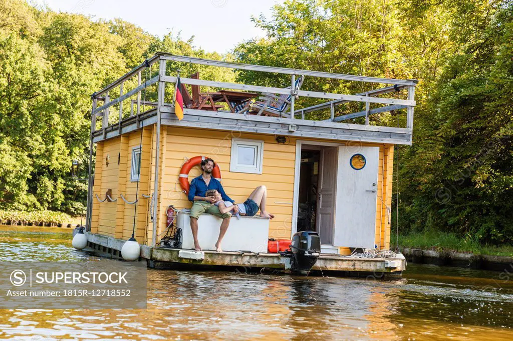 Couple having a trip on a house boat