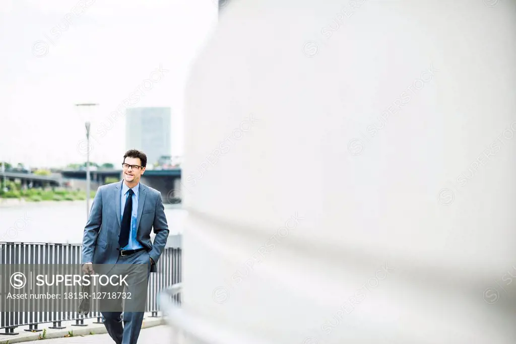 Walking businessman with briefcase