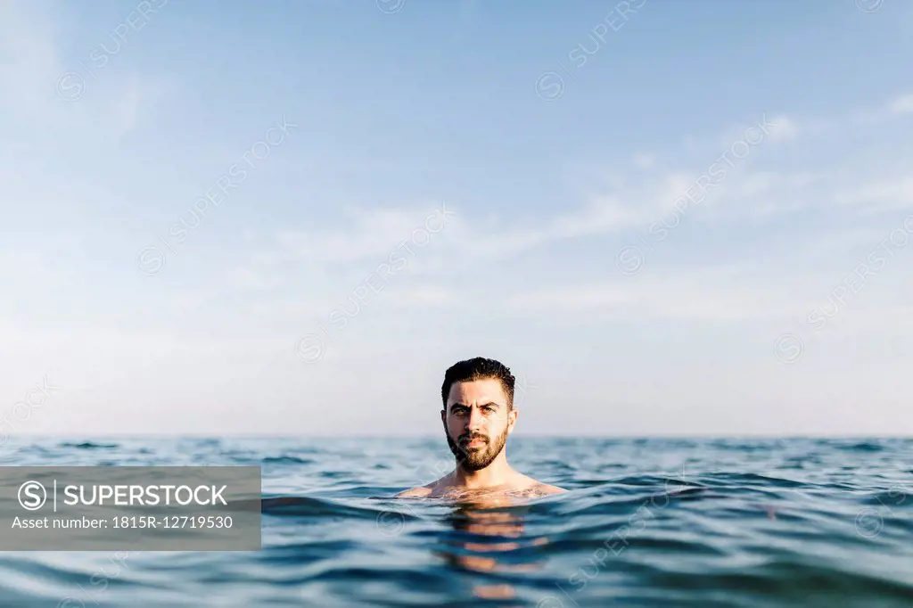 Portrait of young man in the sea