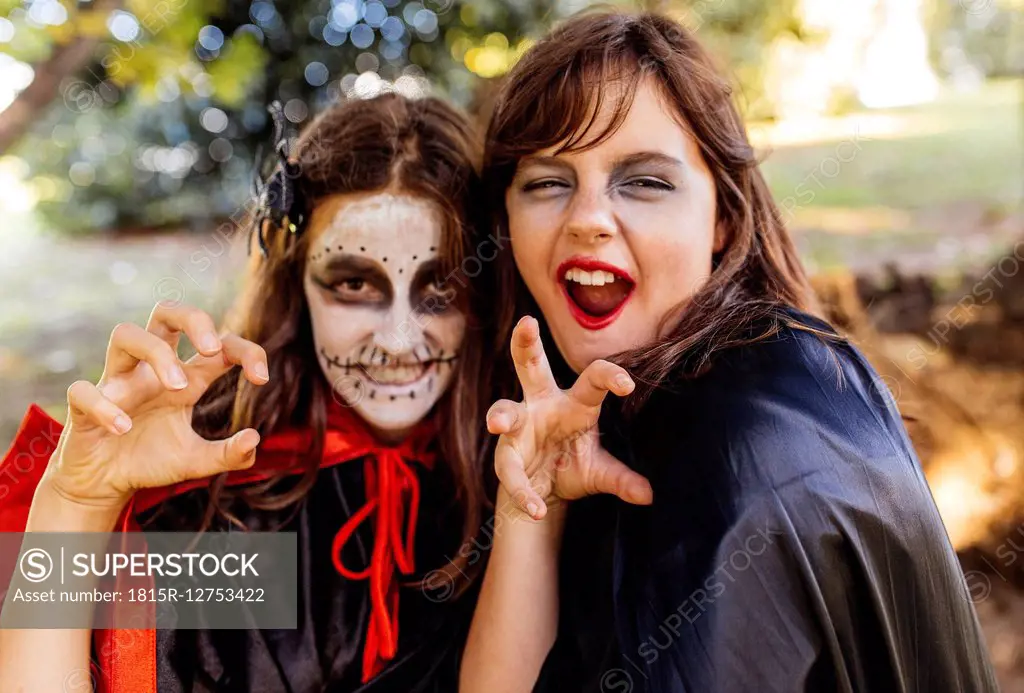 Portrait of two masquerade girls at Halloween