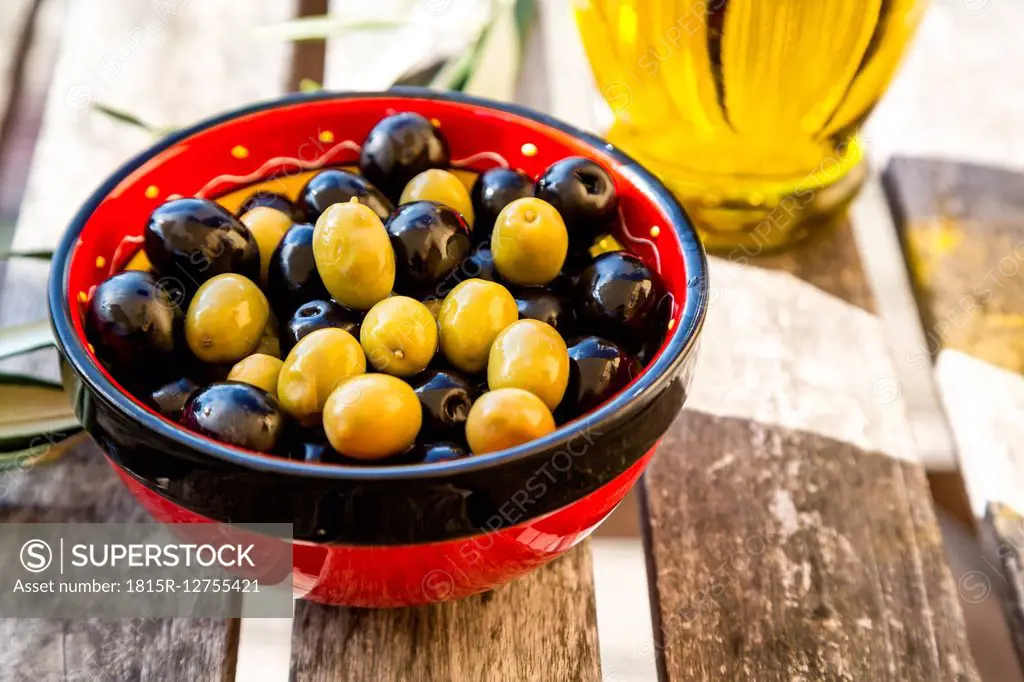 Bowl with green and black olives