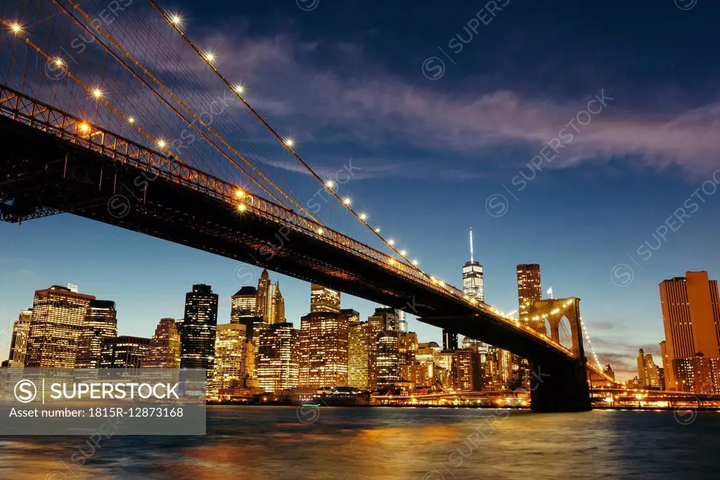USA, New York, New York City, Manhattan, Brooklyn Bridge and skyline during a summer night