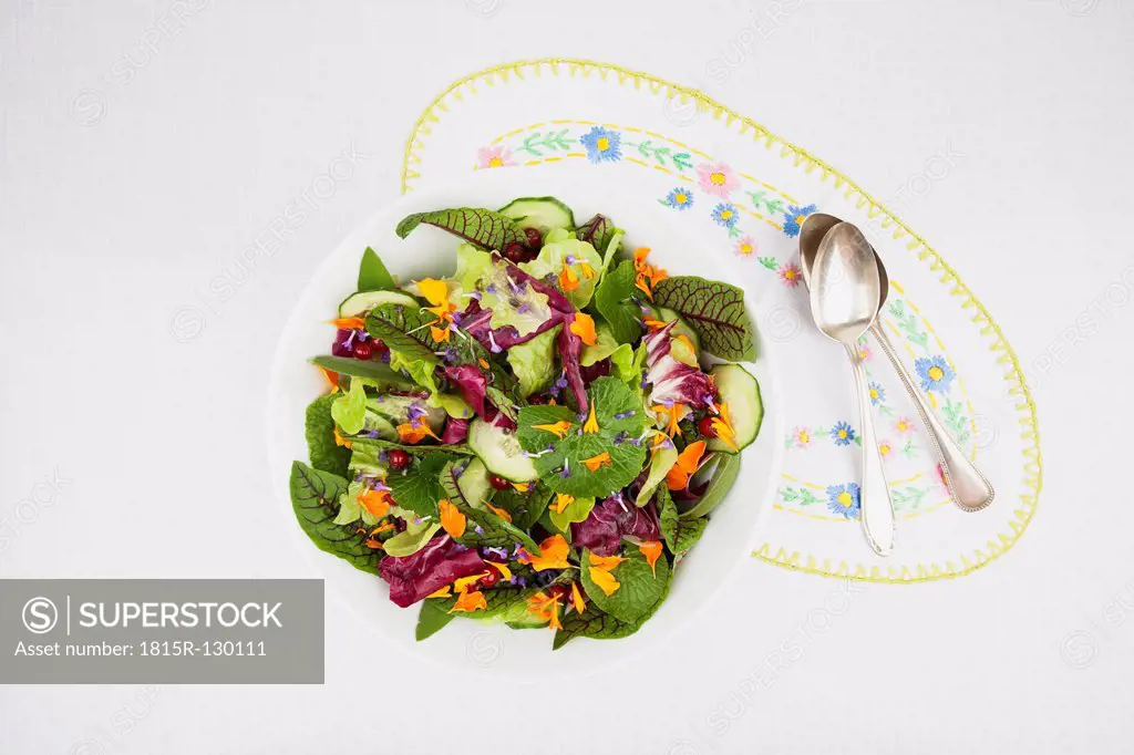 Bowl with salad on place mat, close up