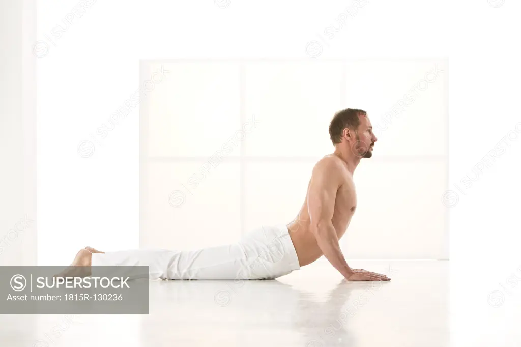 Mature man exercising cobra pose