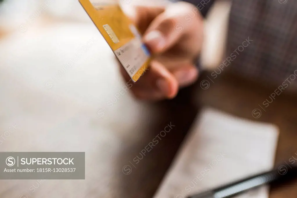 Close-up of hand holding credit card