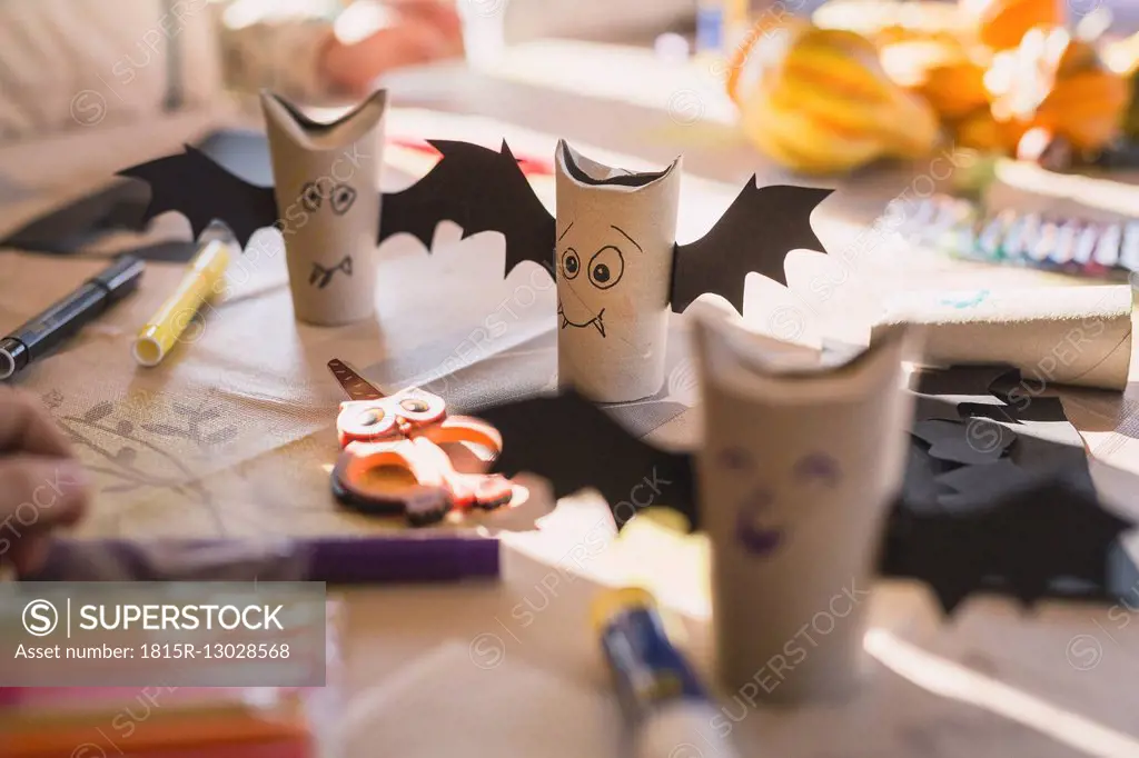 Tinkered paper bats on desk