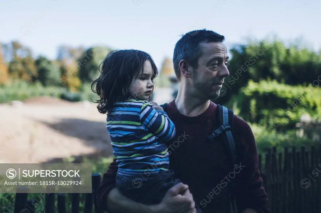 Father holding his son outdoors