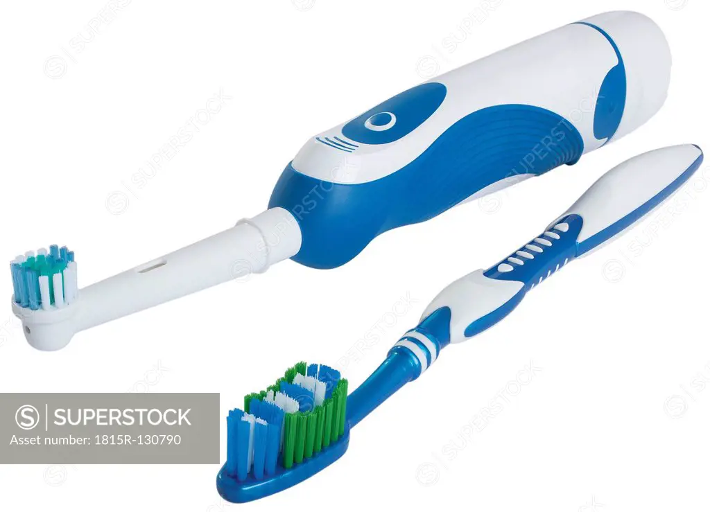 Electric and manual toothbrushes on white background, close up