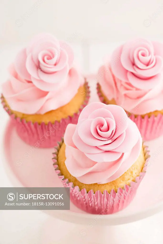 Three pink cup cakes, close-up