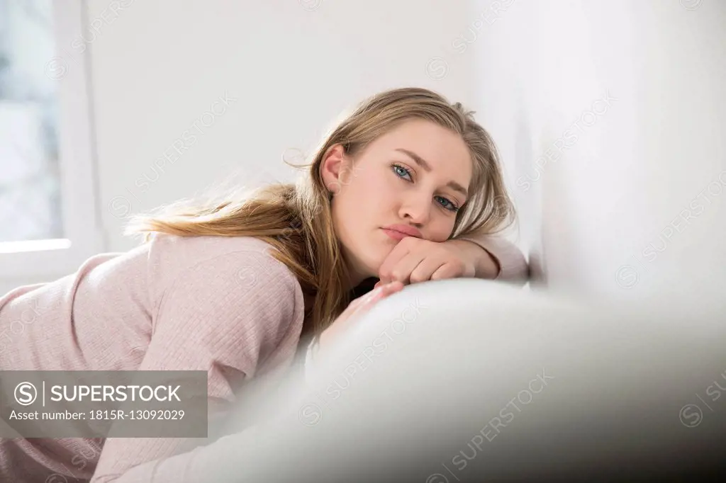 Portrait of young woman pouting mouth