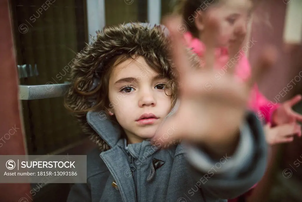 Portrait of little girl showing stop gesture