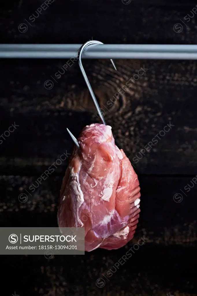 Roast pork on meat hook