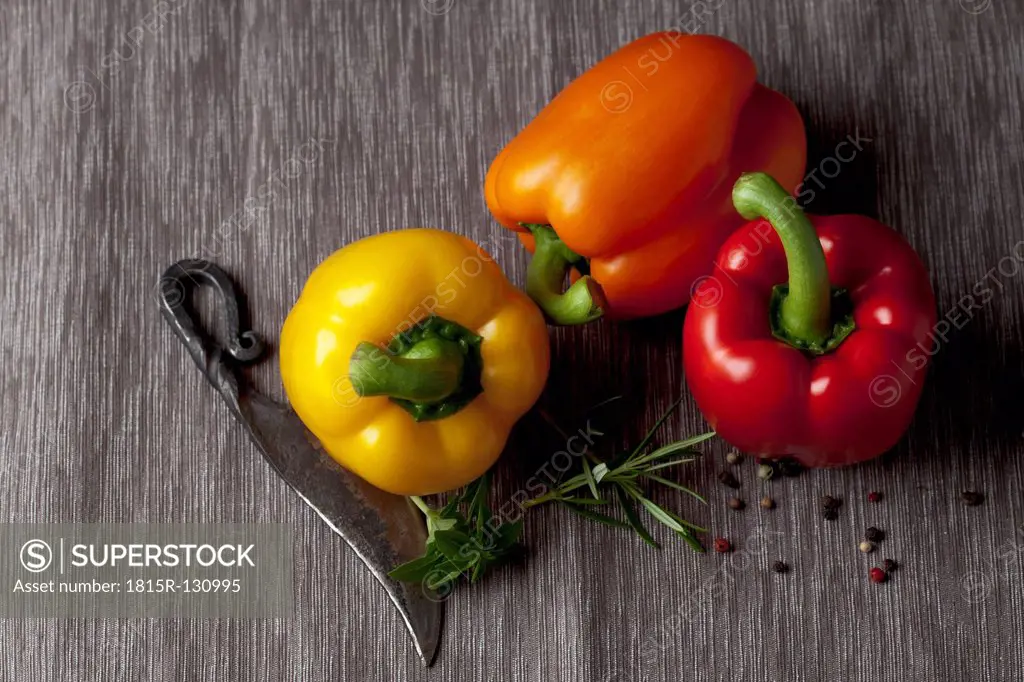 Capsicum with knife and peppers, close up