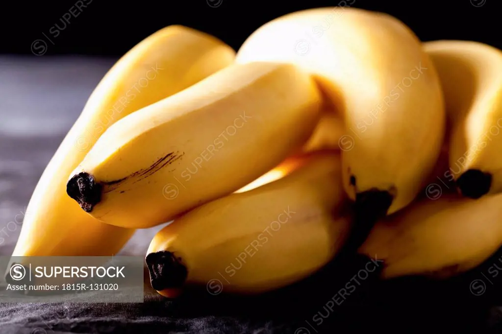 Bunch of bananas on textile, close up