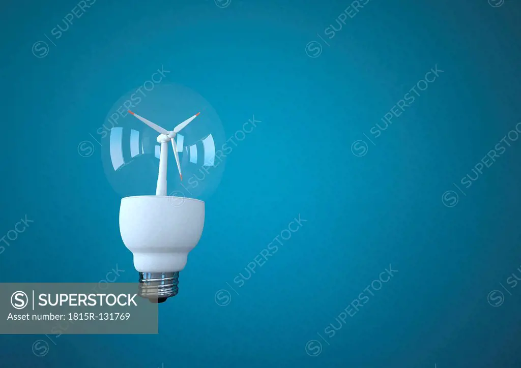 Bulb with wind turbine against blue background, close up