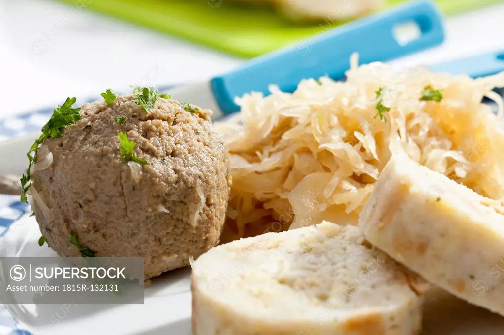 Plate of bread and liver dumpling with sauerkraut, close up