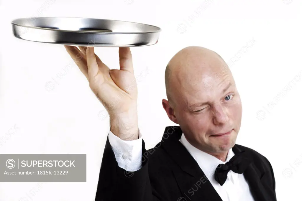 Bartender holding tray, winking, close-up