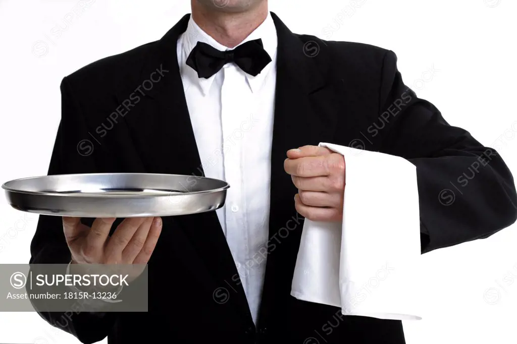 Bartender with empty tray, mid section, close-up