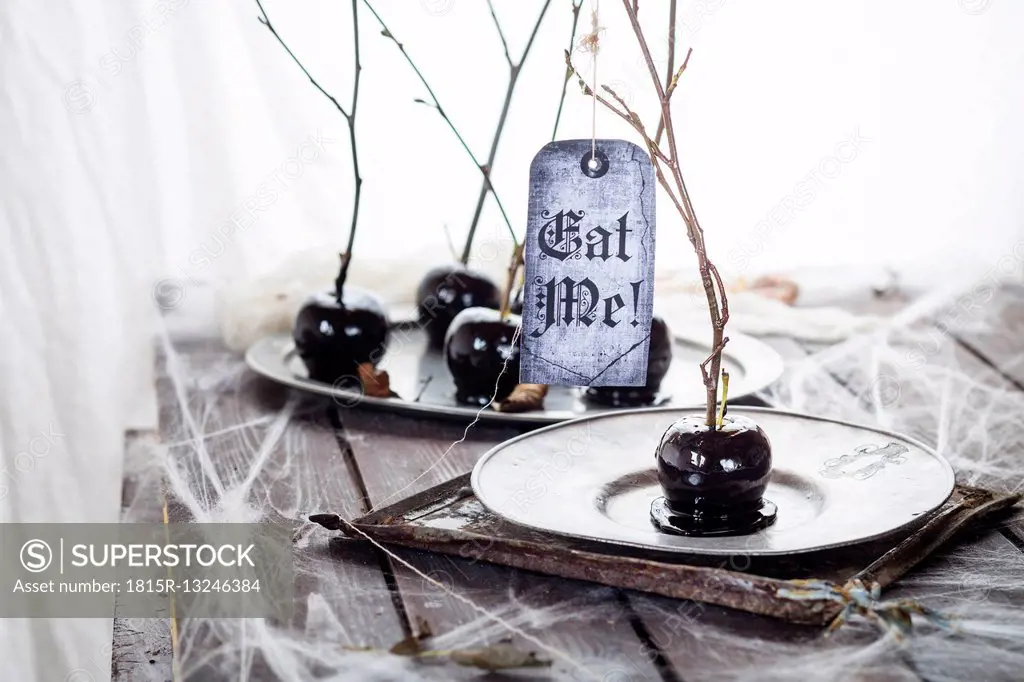 Black candied apples with Halloween decoration