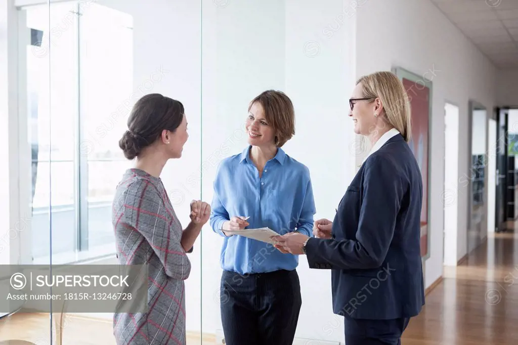Three businesswomen discussing in office