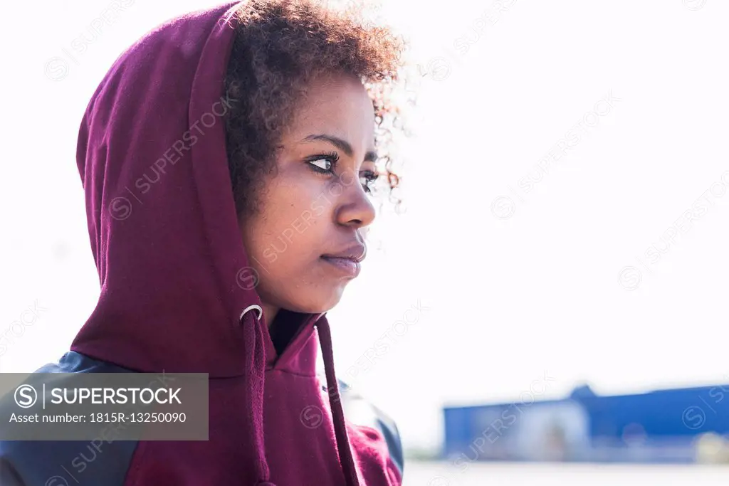Young woman wearing hoodie outdoors