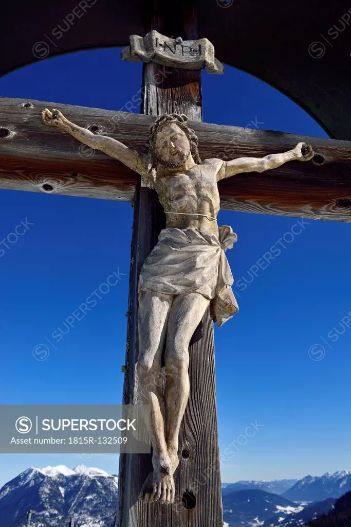 Germany, Bavaria, Carved wooden Jesus crucifix on Kreuzeck Mountain