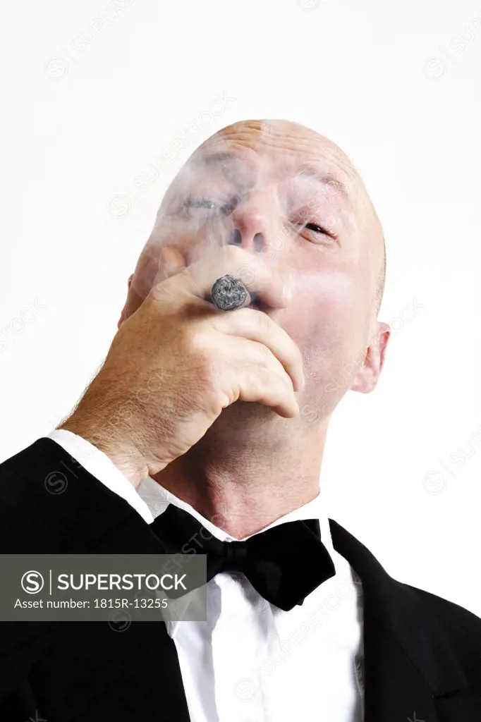 Man smoking cigar, portrait