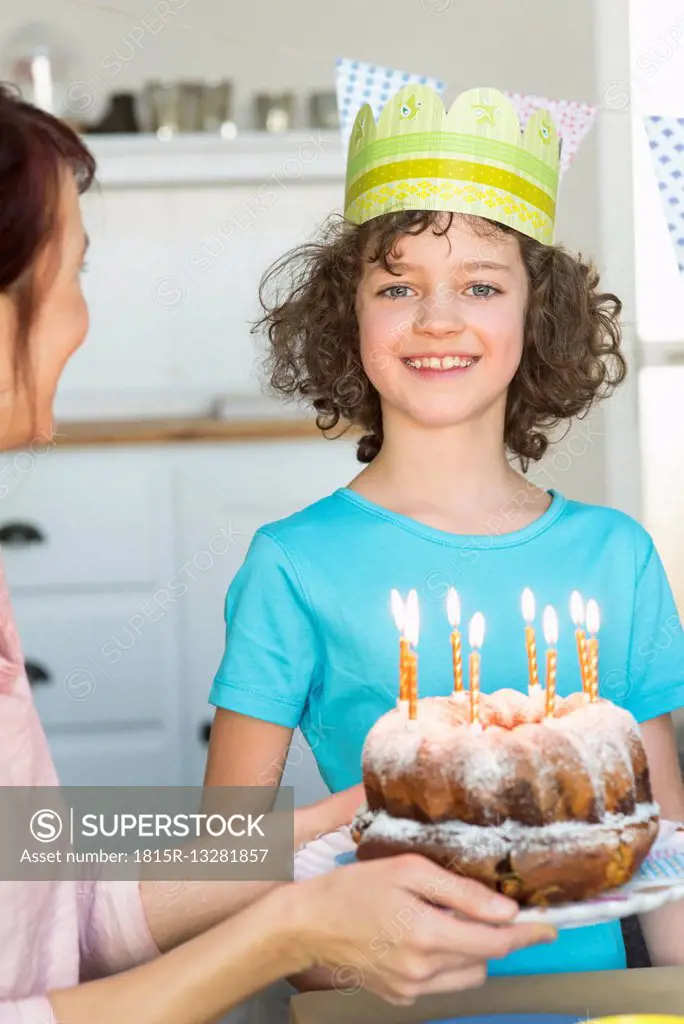 Girl receiving birthday cake