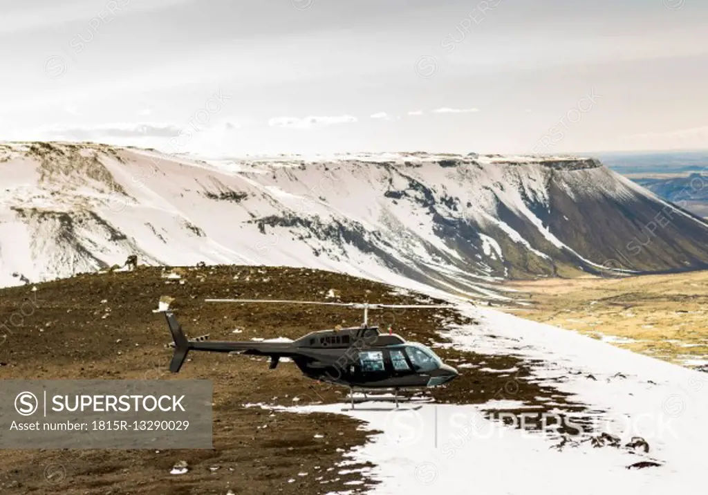 Iceland, a helicopter on a mountain