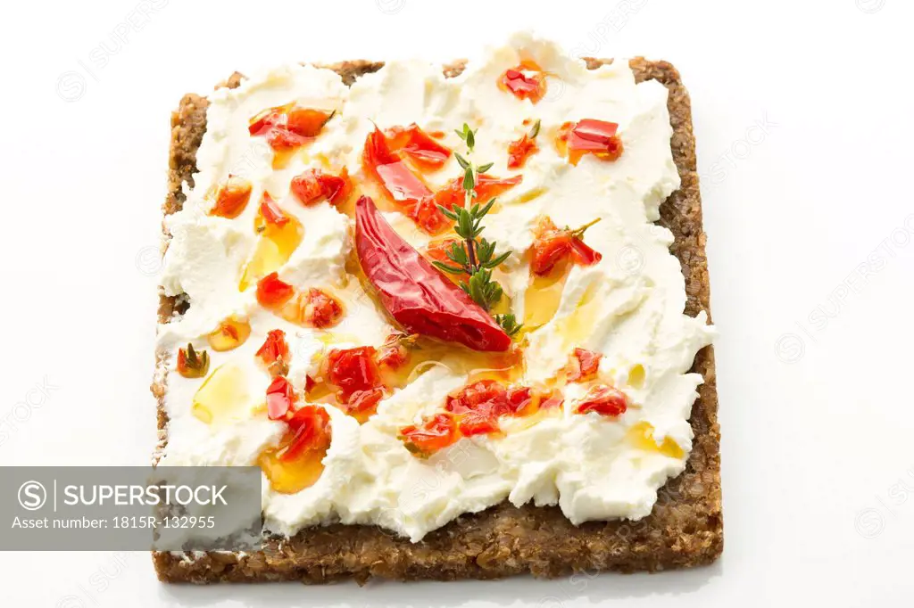 Spicy sandwich with cream cheese and chili on white background, close up