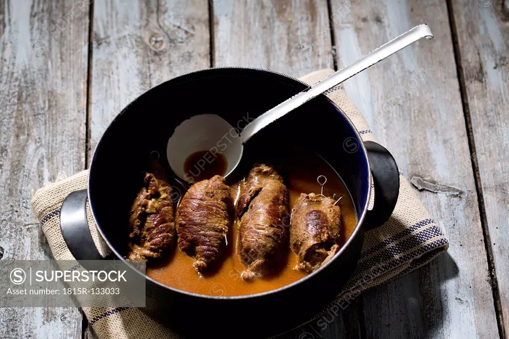 Beef roulades in cooking pot, close up