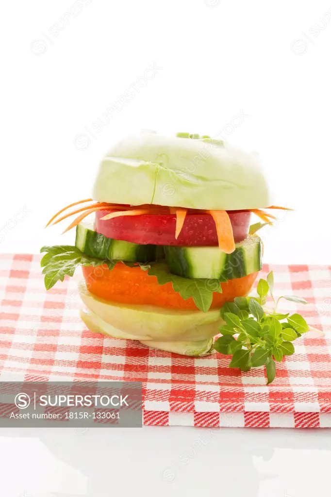 Vegetable burger on checked napkin, close up