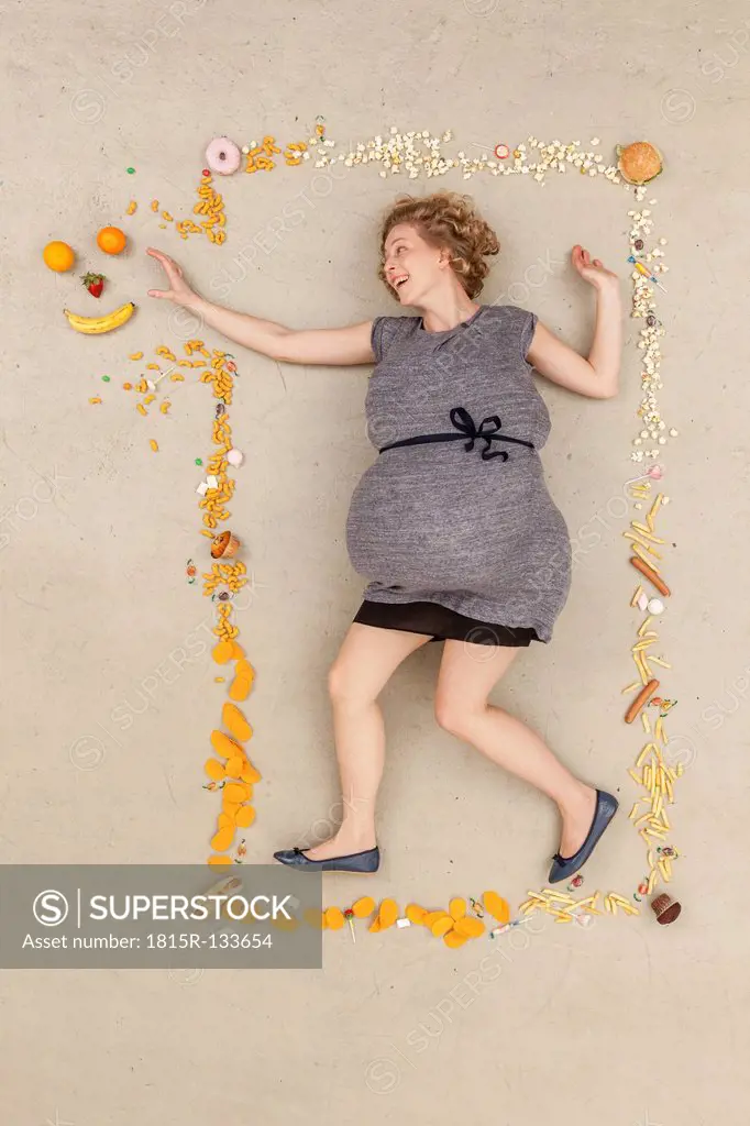 Germany, Berlin, Woman surrounded with food
