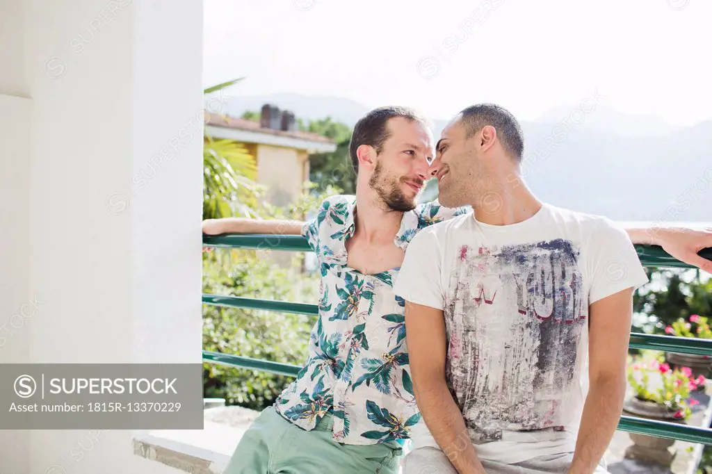Loving gay couple outdoors
