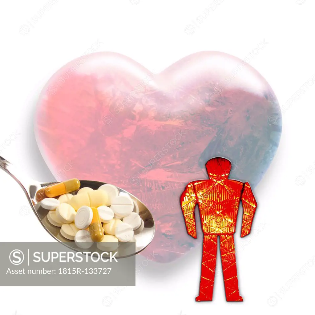 Heart shape with figurine and spoon of tablets in foreground, close up