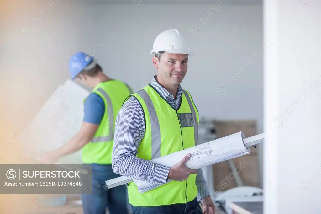Confident architect on construction site
