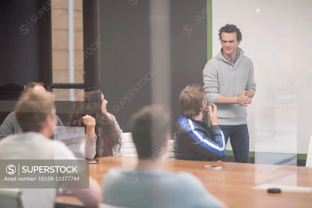 Young business people discussing in business meeting