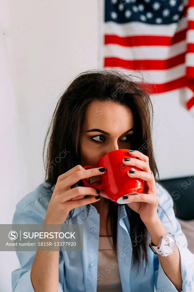 Young woman drinking a coffee