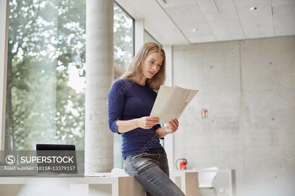 Young woman looking at documents