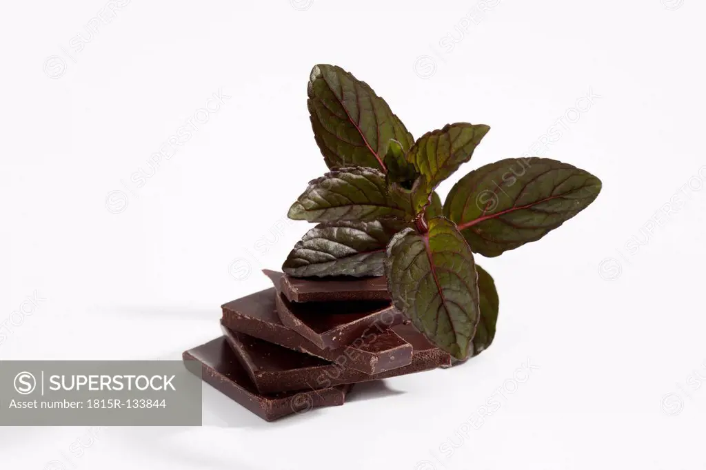 Chocolate and peppermint on white background, close up