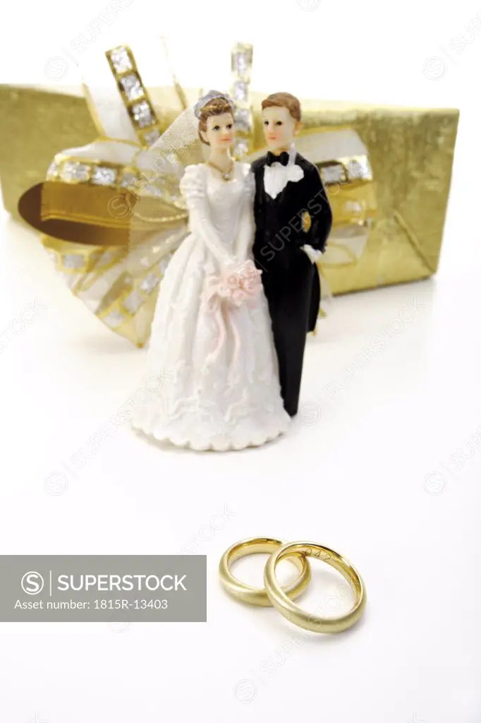 Wedding couple between wedding present and wedding rings