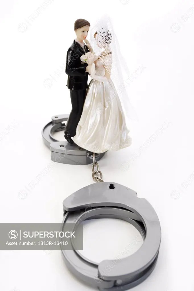 Wedding couple figurines and handcuff