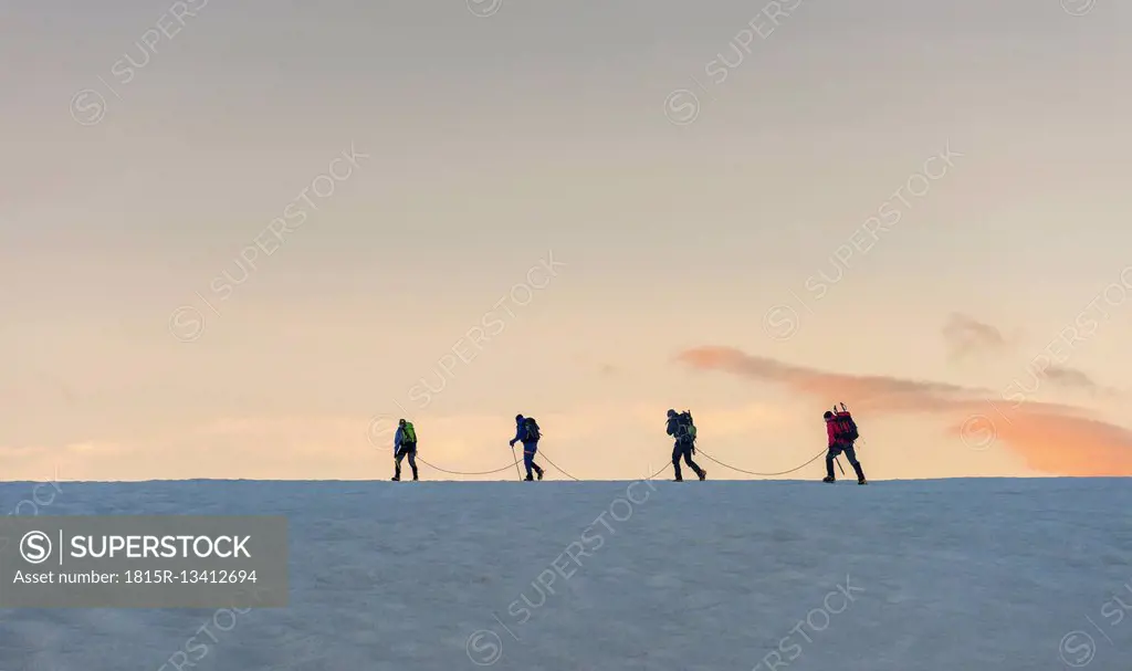 Switzerland, Mountaineers starting early morning from the Bertol Hut
