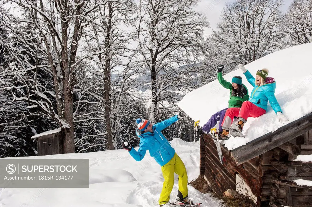Austria, Salzburg, Young women and man having fun in snow at Altenmarkt Zauchensee
