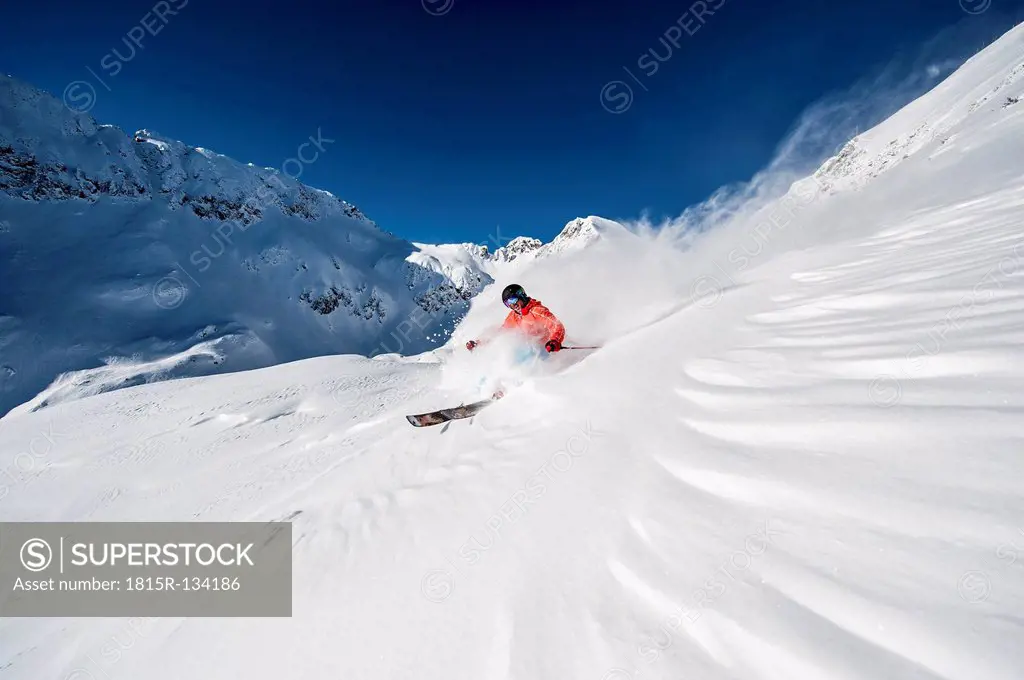 Austria, Salzburg, Young man skiing in mountain of Altenmarkt Zauchensee