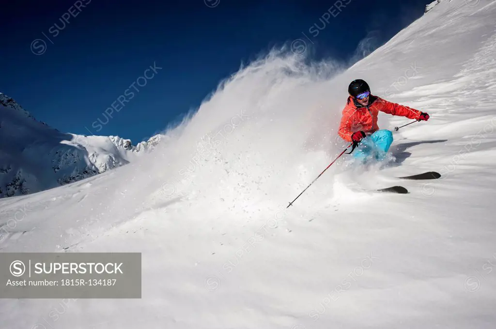 Austria, Salzburg, Young man skiing in mountain of Altenmarkt Zauchensee