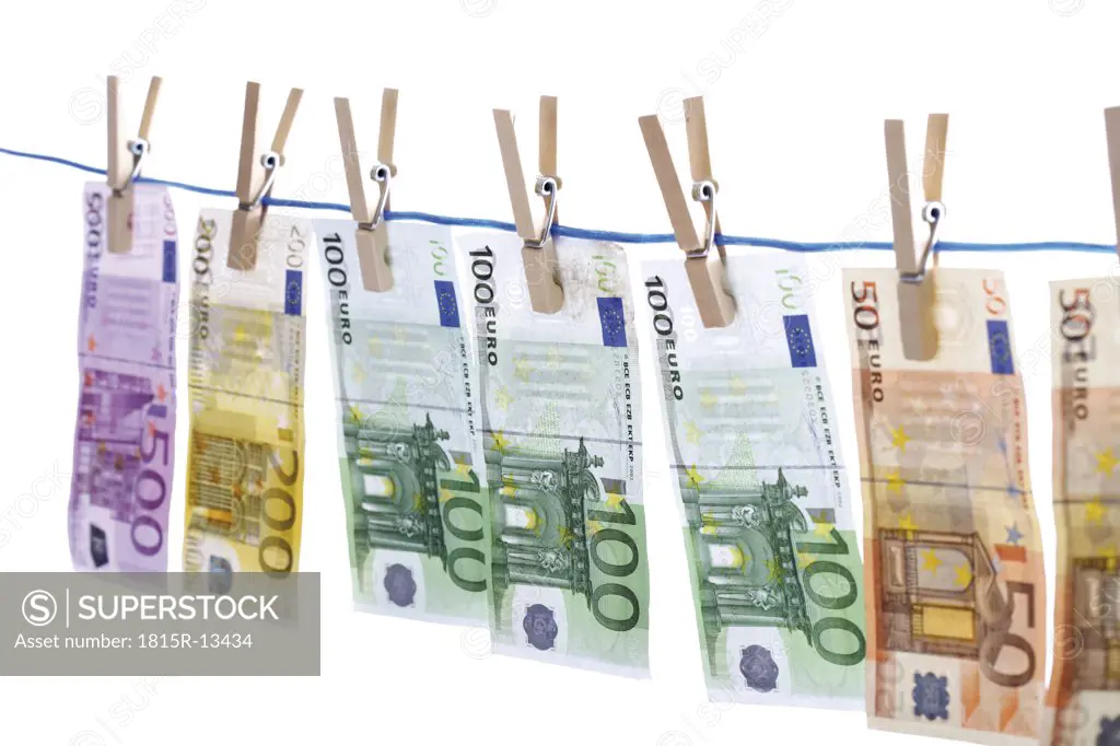 Euro notes on washing line, close-up