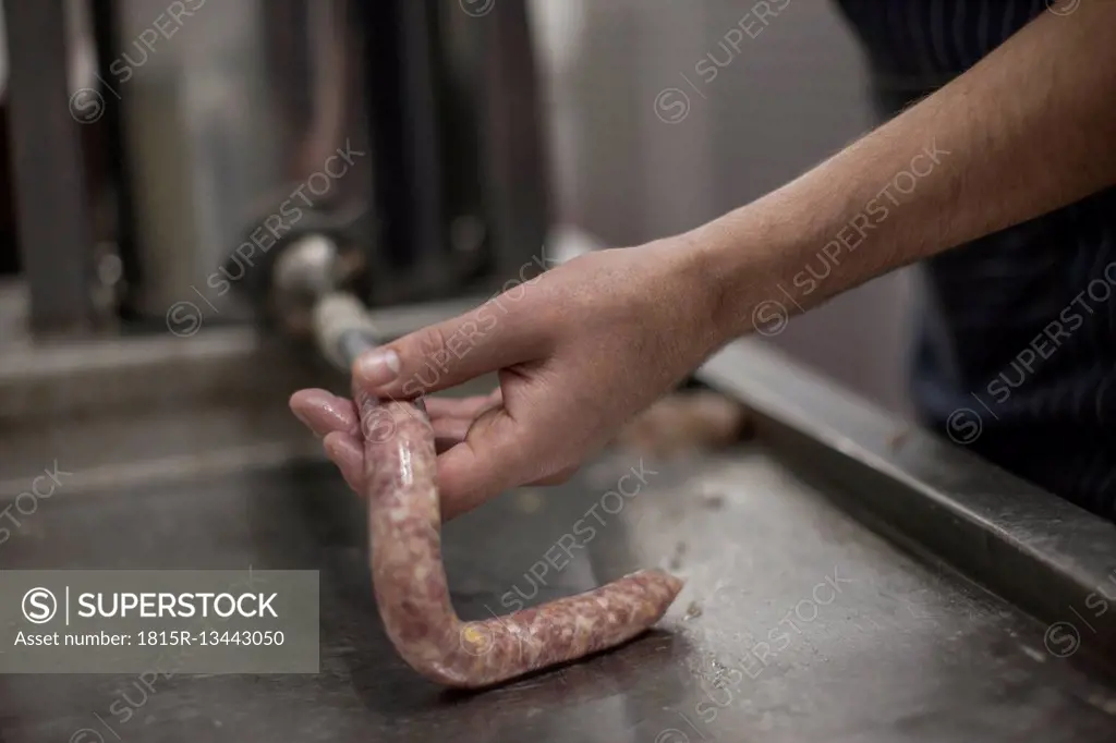 Butcher making sausages in butchery